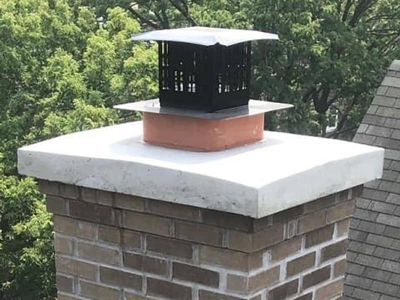 new crown poured flat over the brick stack on a chimney in Woodbridge, NJ