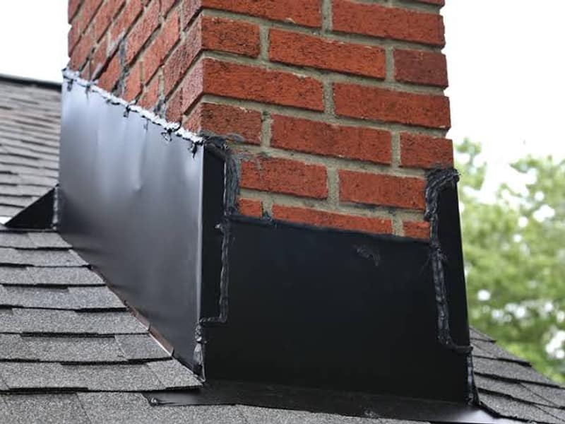 new flashing sealed where the stack meets the roof on a chimney in Woodbridge, NJ
