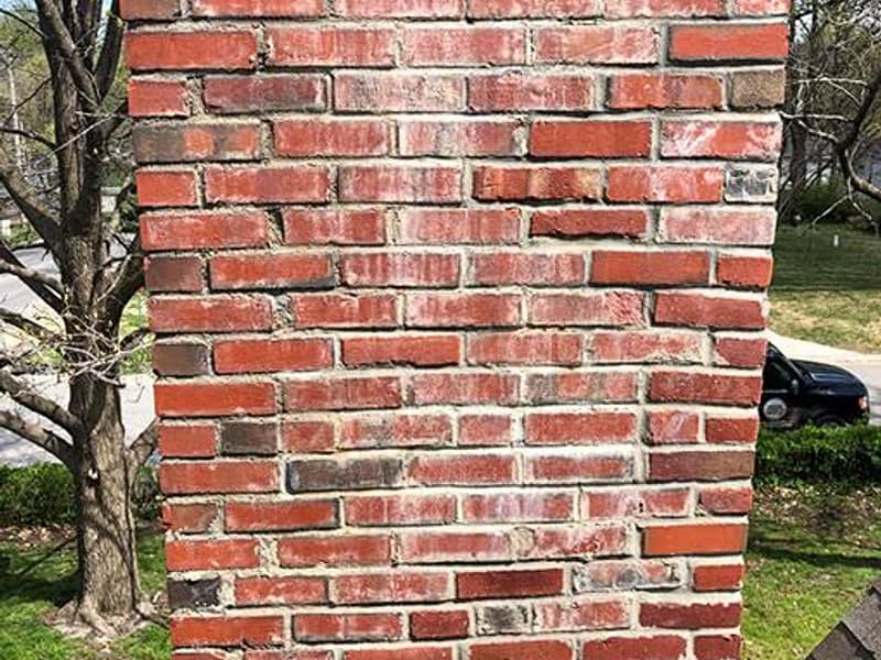 open joints across a weathered brick face on a chimney in Woodbridge, NJ