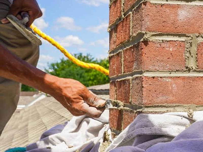 fresh mortar packed into the cut joints on a chimney in Woodbridge, NJ