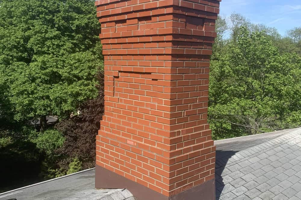 Brick chimney above the roofline on a home in Sewaren, NJ